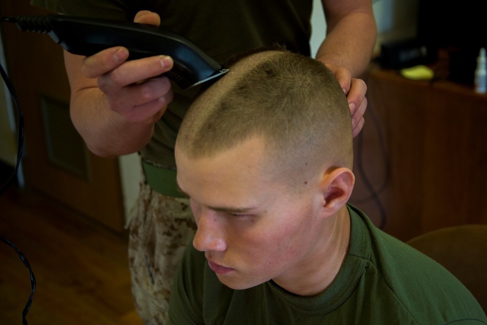Marine shaves his head