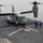 Osprey makes first ever landing on Republic of Korea amphibious assault ship A V-22 Osprey tiltrotor aircraft is on the flight deck of a naval vessel, with rotors spinning in helicopter mode. Multiple deck crew members in colored safety vests are positioned around the aircraft, indicating an active landing or pre-departure operation. The scene takes place over open water, visible beyond the ship's deck edge.