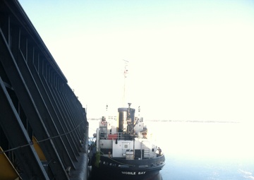 USCGC Mobile Bay secures breakaway barge