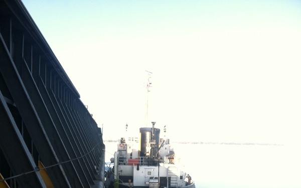 USCGC Mobile Bay secures breakaway barge