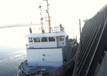 USCGC Mobile Bay secures breakaway barge
