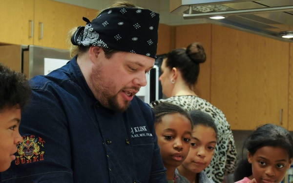 Parents and their kids cook healthy and tasty meals