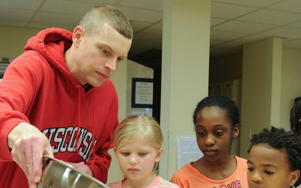 Parents and their kids cook healthy and tasty meals