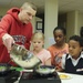 Parents and their kids cook healthy and tasty meals
