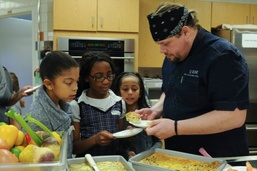 Parents and their kids cook healthy and tasty meals