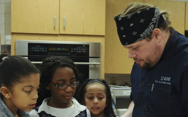 Parents and their kids cook healthy and tasty meals