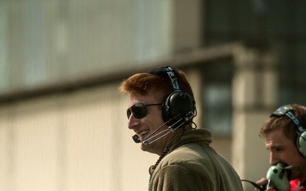 Airmen refuel F-16's during a hot pit refuel