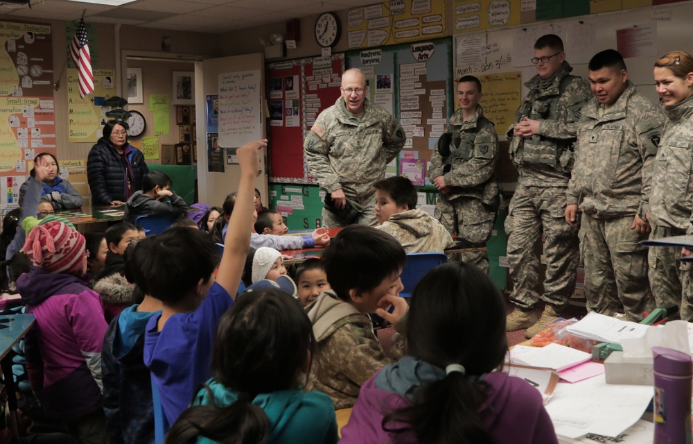 Alaska Army National Guard Soldiers visit with Napaskiak students during annual training