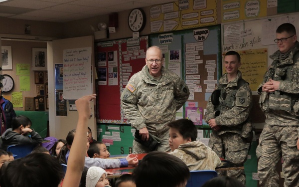 Alaska Army National Guard Soldiers visit with Napaskiak students during annual training