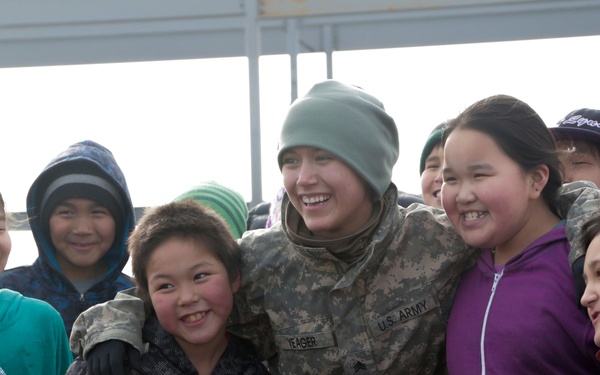 Alaska Army National Guard Soldiers visit with Napaskiak students during annual training
