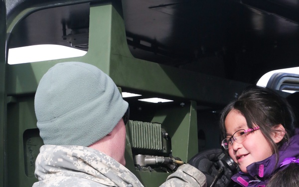 Alaska Army National Guard Soldiers visit with Napaskiak students during annual training