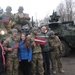 US troops with Latvians and their flag