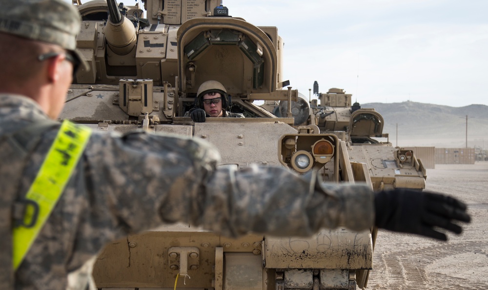 Soldiers assigned to 2nd Brigade Combat Team, 1st Infantry Division, prepare for deployment in the Middle East