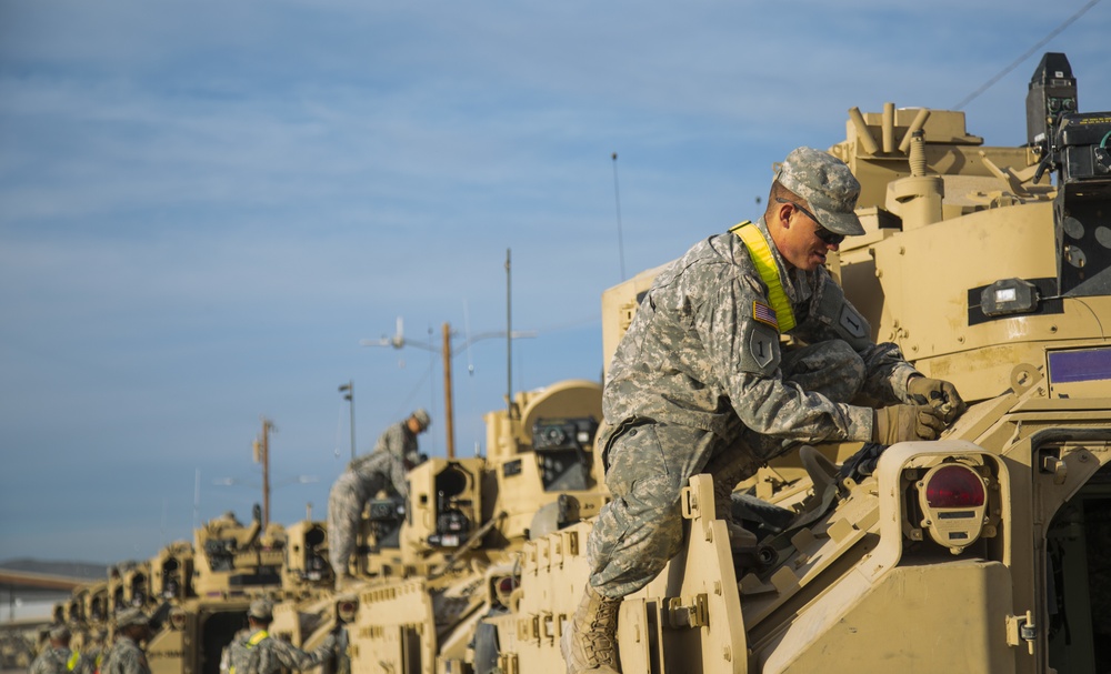 Soldiers assigned to 2nd Brigade Combat Team, 1st Infantry Division, prepare for deployment in the Middle East