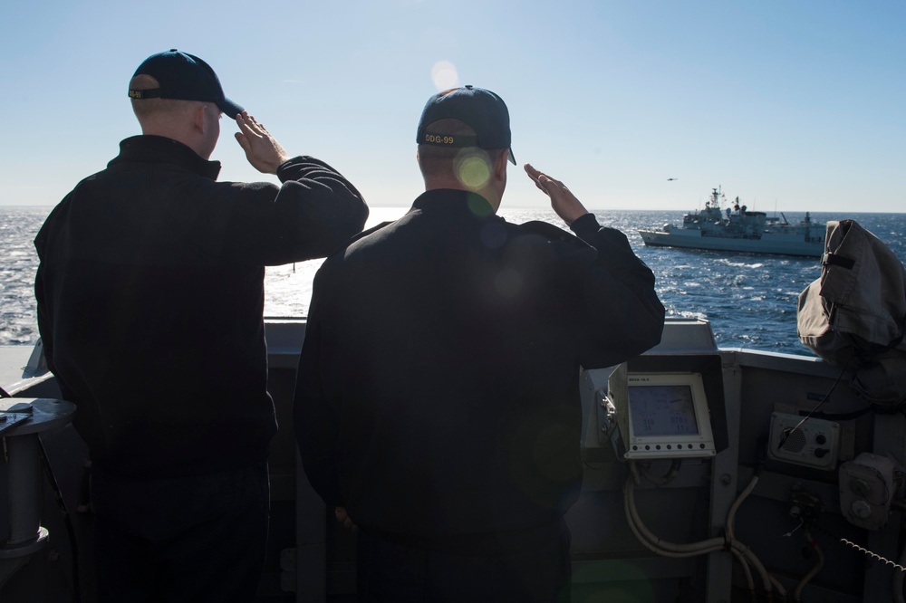 USS Farragut renders honors