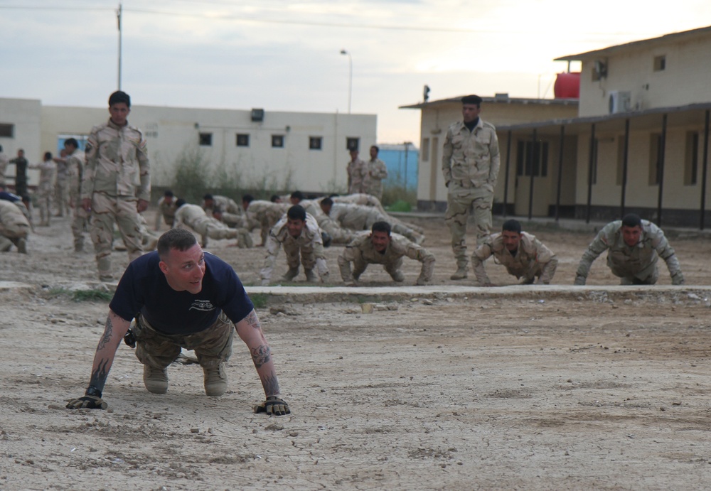 Iraqi soldiers conduct physical training with 82nd Airborne