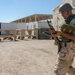 Iraqi soldier examines his rifle