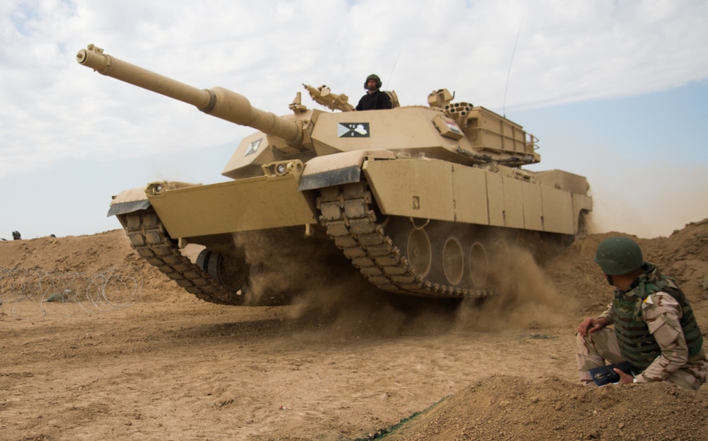 Iraqi tank breaches obstacle