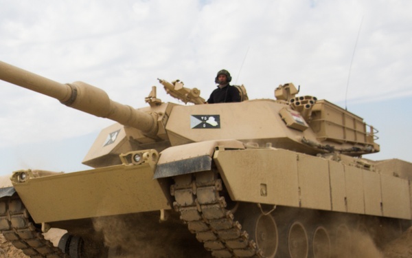 Iraqi tank breaches obstacle