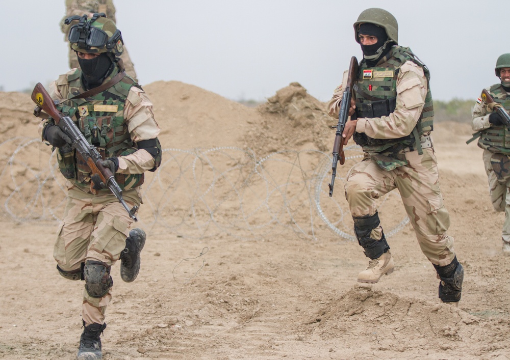 Iraqi soldiers sprint towards objective