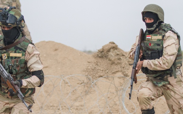 Iraqi soldiers sprint towards objective