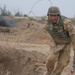 Iraqi soldiers removes razor wire during training