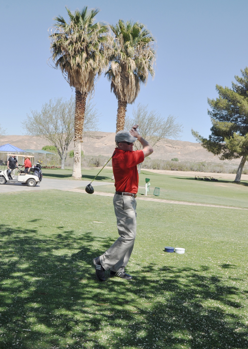 Brig. Gen. Edward D. Banta takes aim during the Commander's Cup Golf Tournament aboard MCLB Barstow