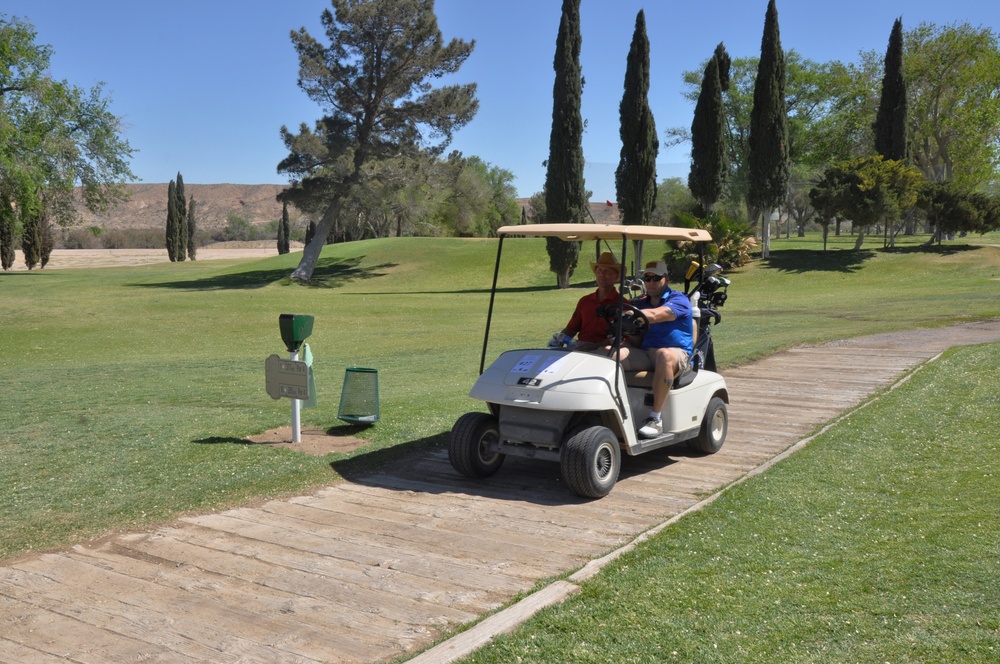 Sgt. Majors Scott D. Helms and Karl D. Simburger cruise the golf course during Commander's Cup