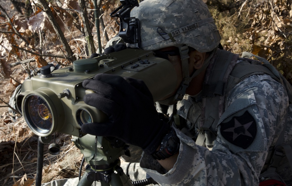 Fire Support NCO spots an enemy target