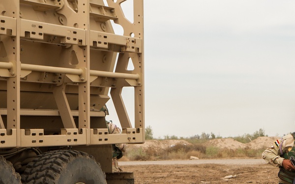 Iraqi soldiers perform vehicle fire drill