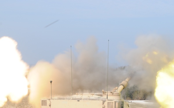 Several M109A6 Paladin self-propelled howitzers conduct test fire