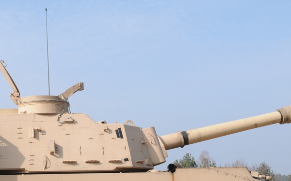 Several M109A6 Paladin self-propelled howitzers conduct test fire