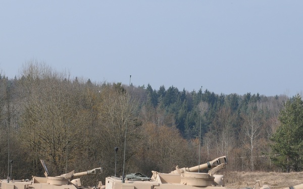 Several M109A6 Paladin self-propelled howitzers conduct test fire