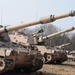 Several M109A6 Paladin self-propelled howitzers conduct test fire