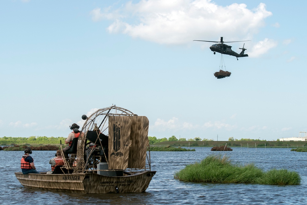 La. National Guard airlifts recycled Christmas trees to restore marshland