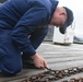 Coast Guard Cutter Elderberry prepares buoys