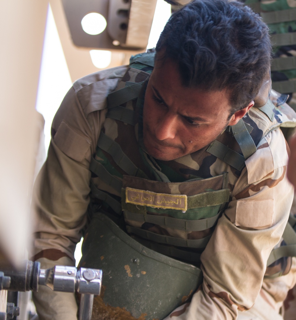 Iraqi soldier changes tire in competition