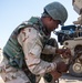 Iraqi soldier prepares MRAP for tow