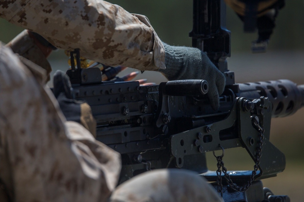 Marines load M-2 .50 caliber machine gun