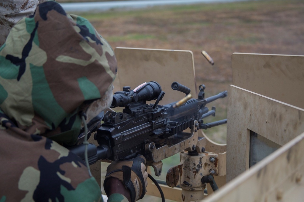 Marine shoots mounted weapon