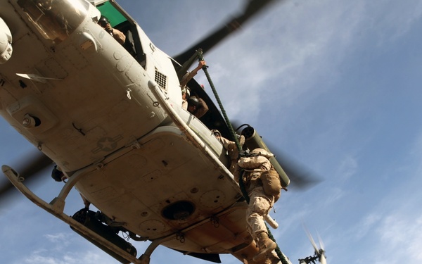 Marines fast rope from hueys during WTI
