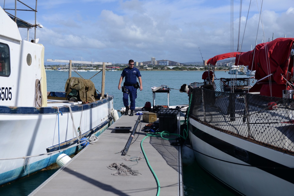 Members from Coast Guard Sector Honolulu enforcement division conduct harbor patrols