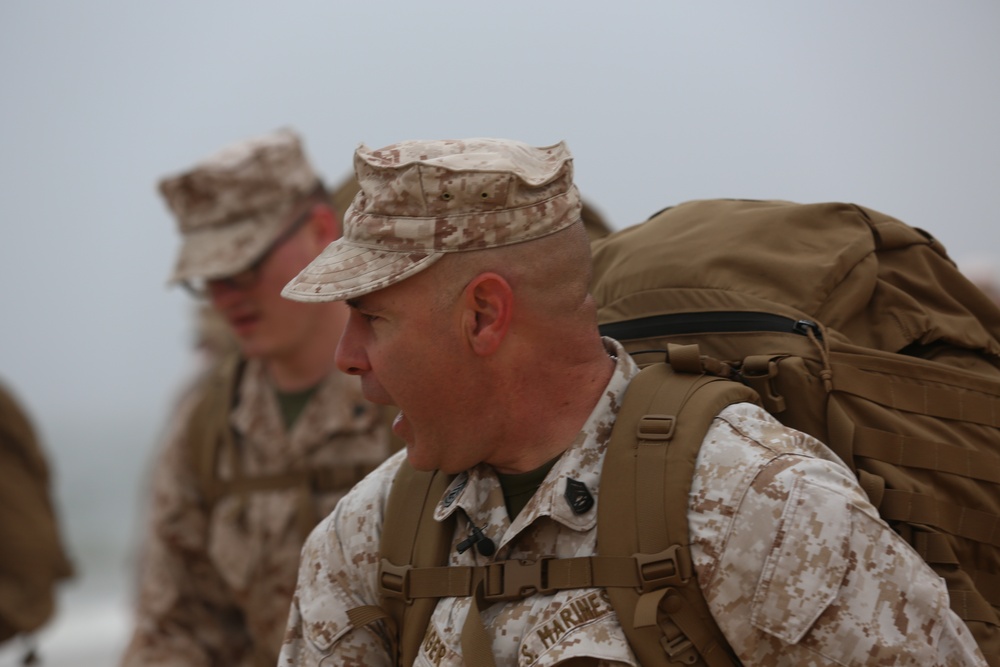 Gunnery Sgt. calls cadence for Marines and sailors