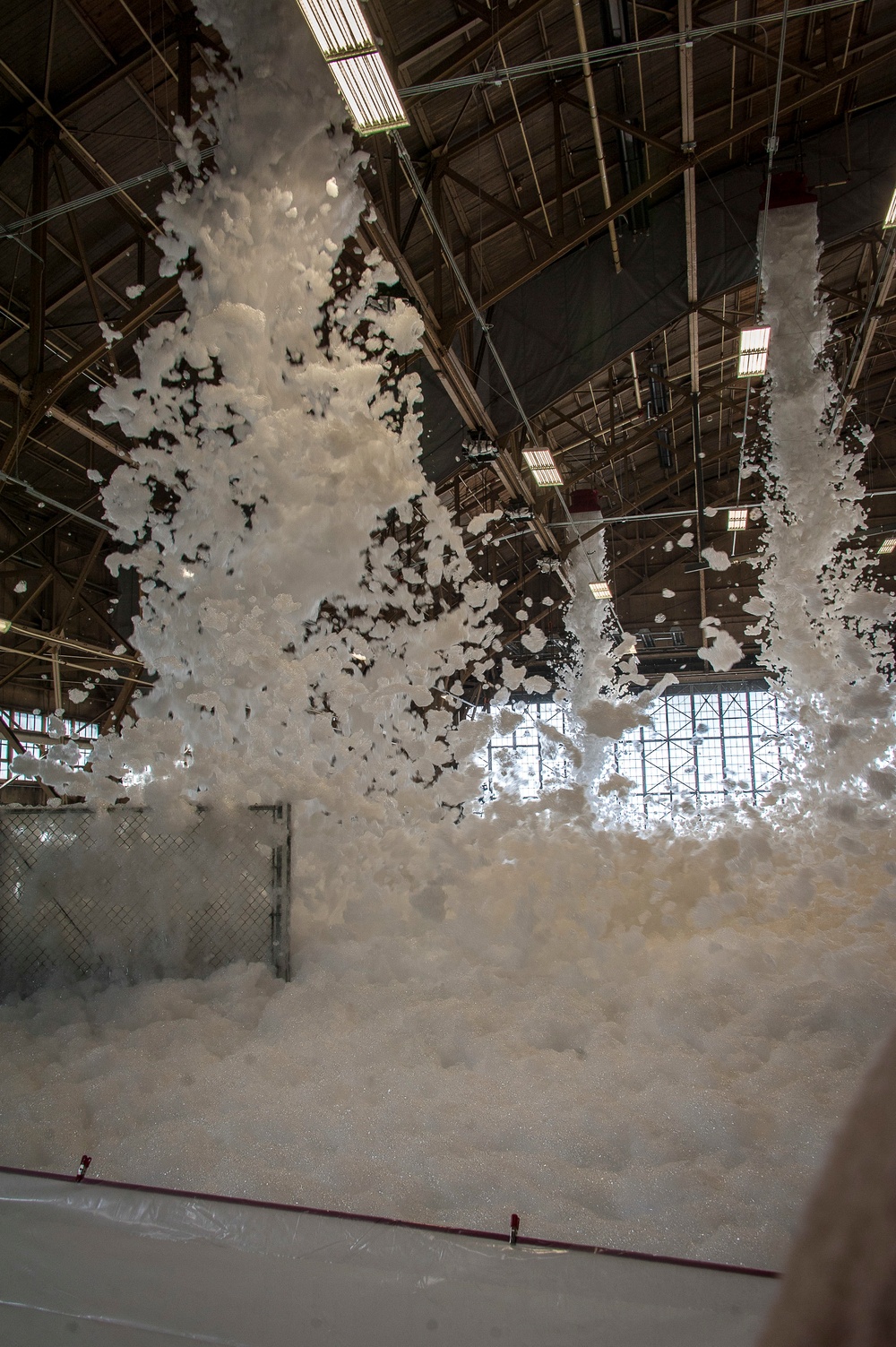 Foam engulfs the maintenance hangar