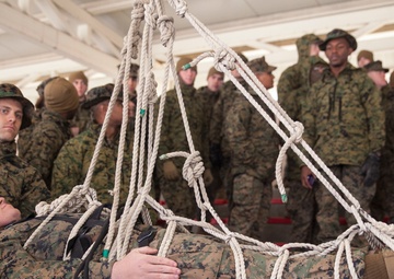 Marine Corps Musicians Hanging from Ropes