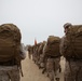 Marines conduct beach hike enhancing unit morale, maintain combat readiness