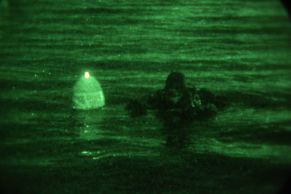 Marine combat divers execute clandestine dive mission
