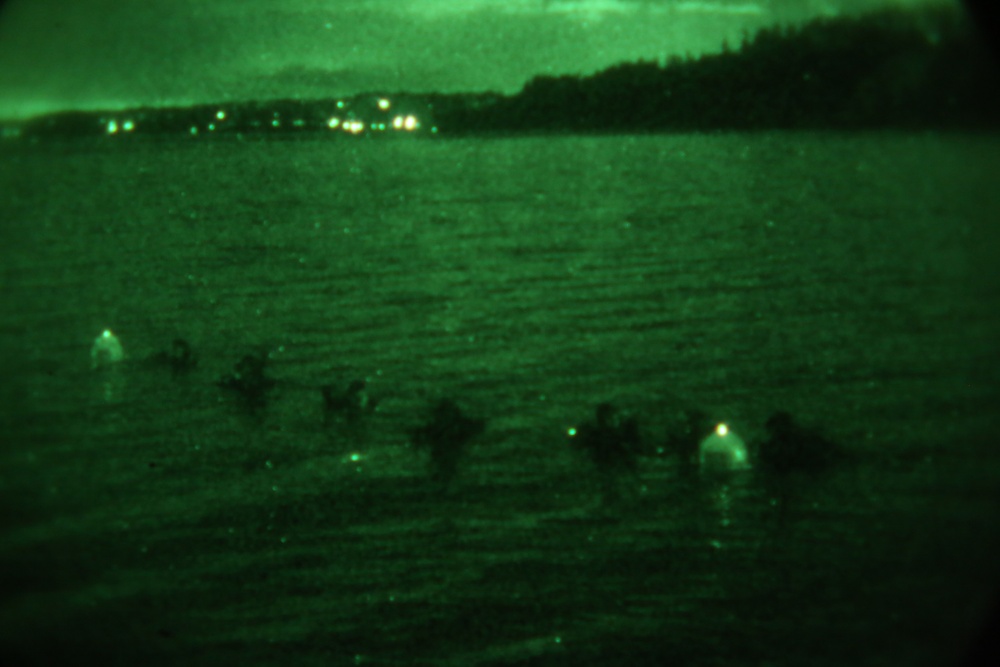 Marine combat divers execute clandestine dive mission