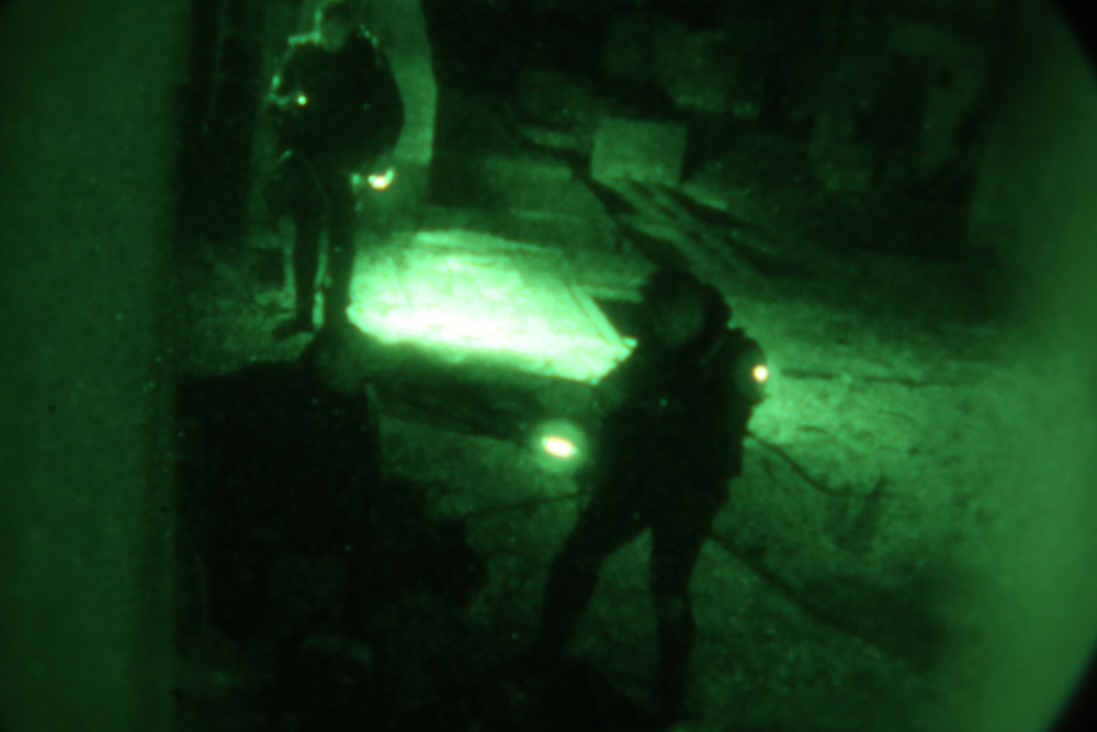 Marine combat divers execute clandestine dive mission