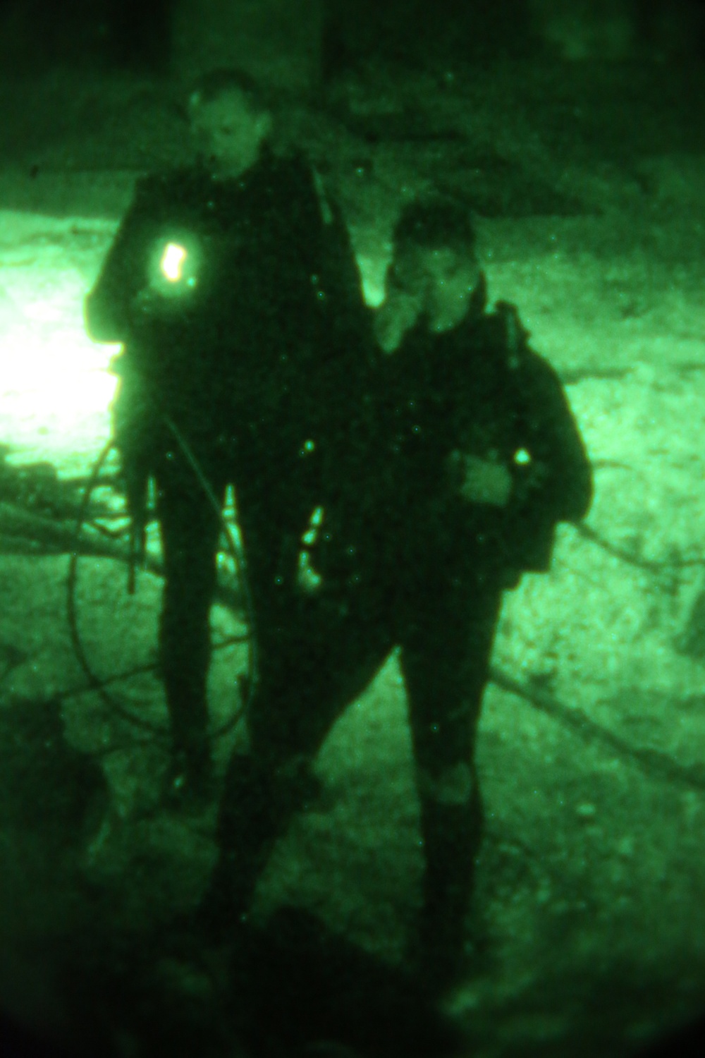 Marine combat divers execute clandestine dive mission